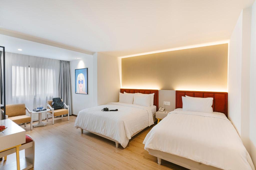 Posteľ alebo postele v izbe v ubytovaní A25 Hotel - 55 Lê Anh Xuân