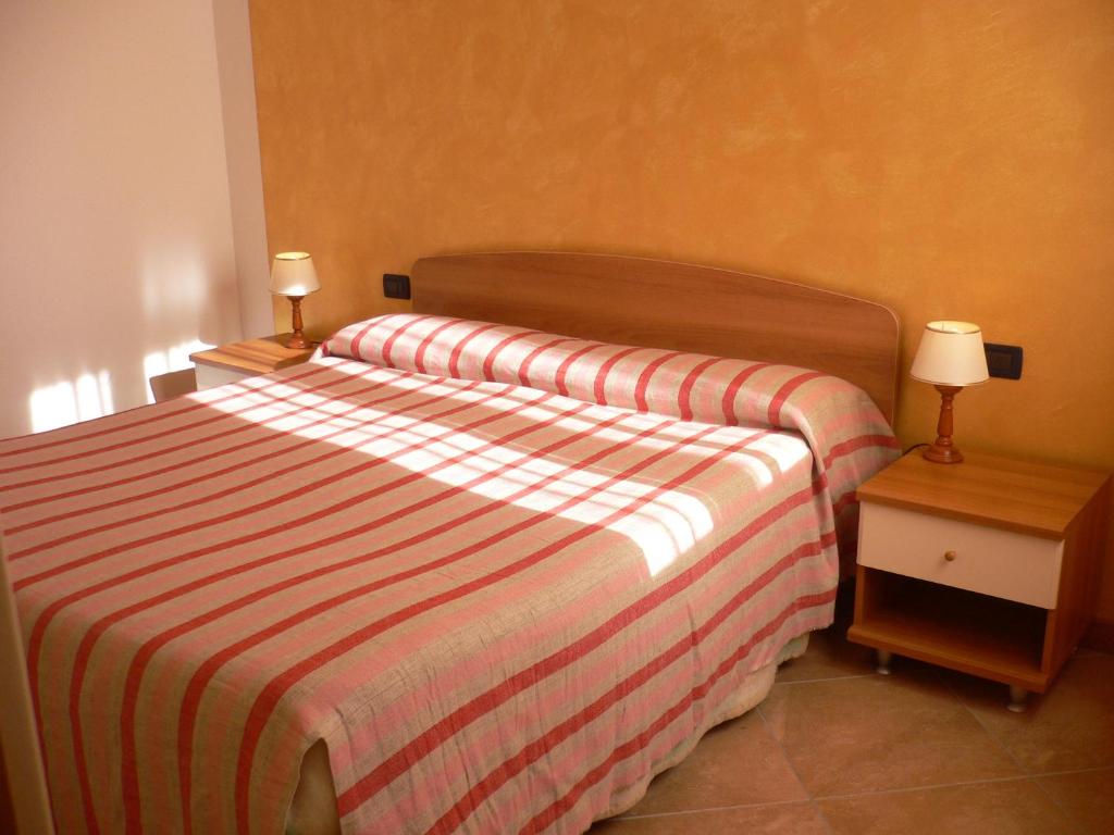 Postel nebo postele na pokoji v ubytování Milan Residence