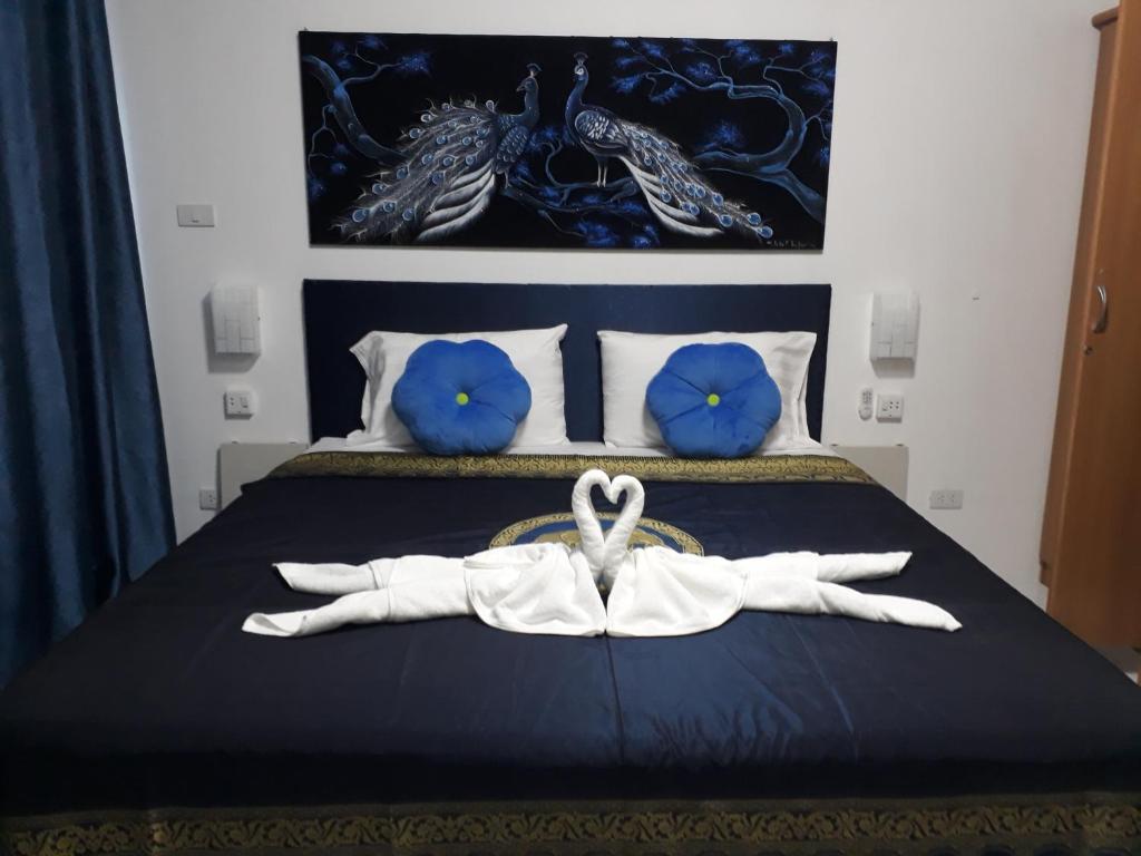 Postel nebo postele na pokoji v ubytování B&B NAMO PHUKET