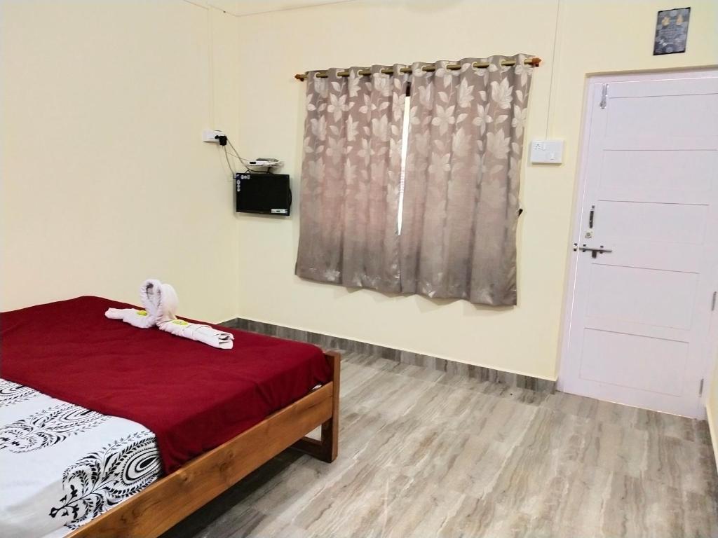 Postel nebo postele na pokoji v ubytování Hotel Rosary House