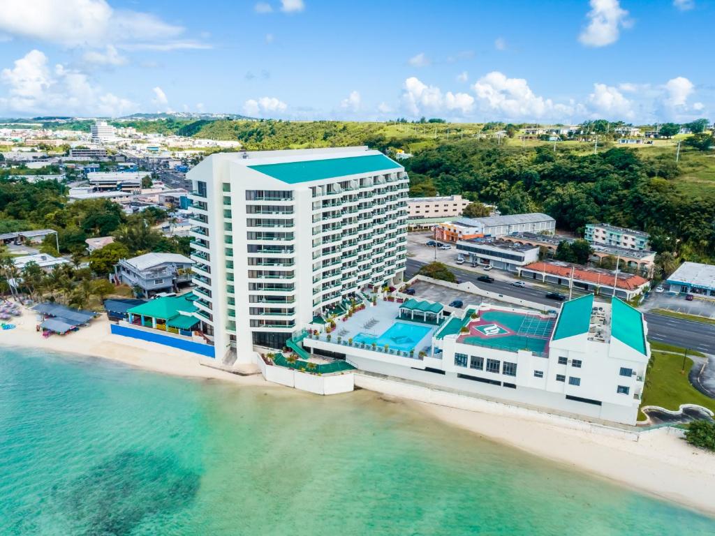 an aerial view of a hotel on the beach at Alupang Beach Tower in Tamuning