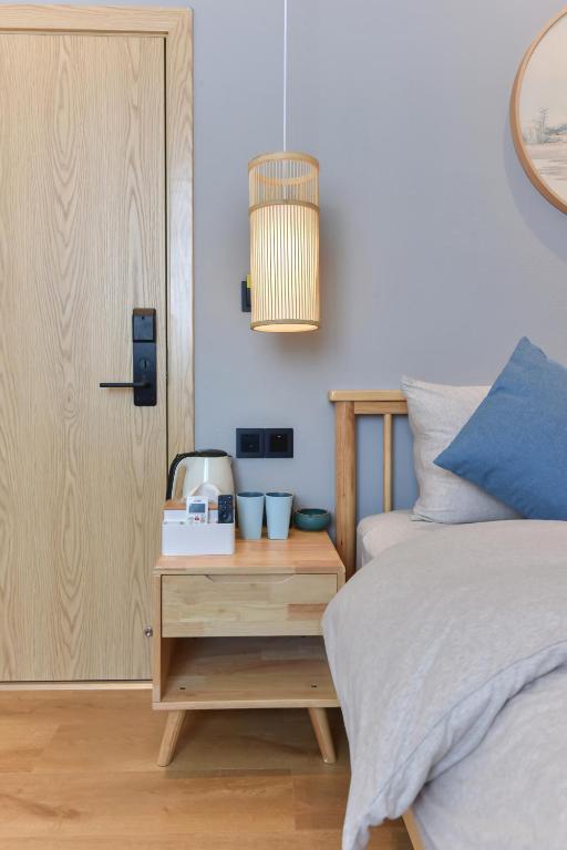 Postel nebo postele na pokoji v ubytování Yifangyan - Tingyuan Qingshe Hostel