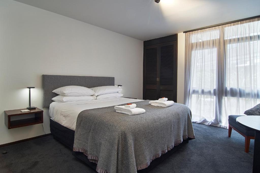 Postel nebo postele na pokoji v ubytování Hotel Carlton Mill