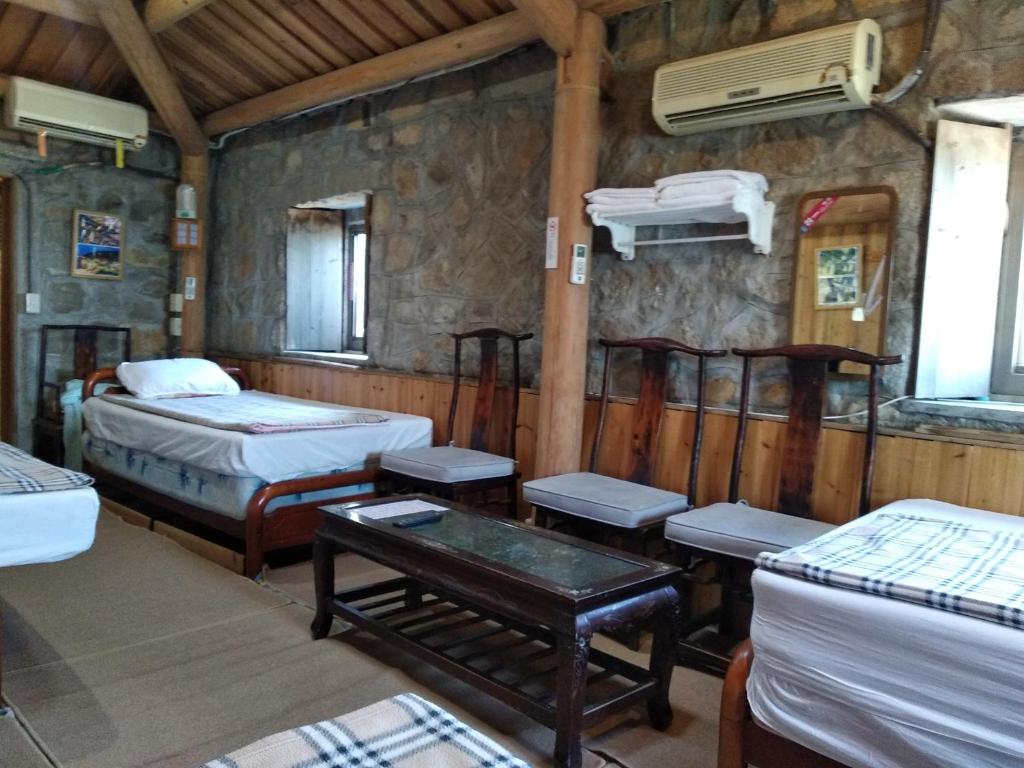Postel nebo postele na pokoji v ubytování Chin -Be Village Cafe & Homestay