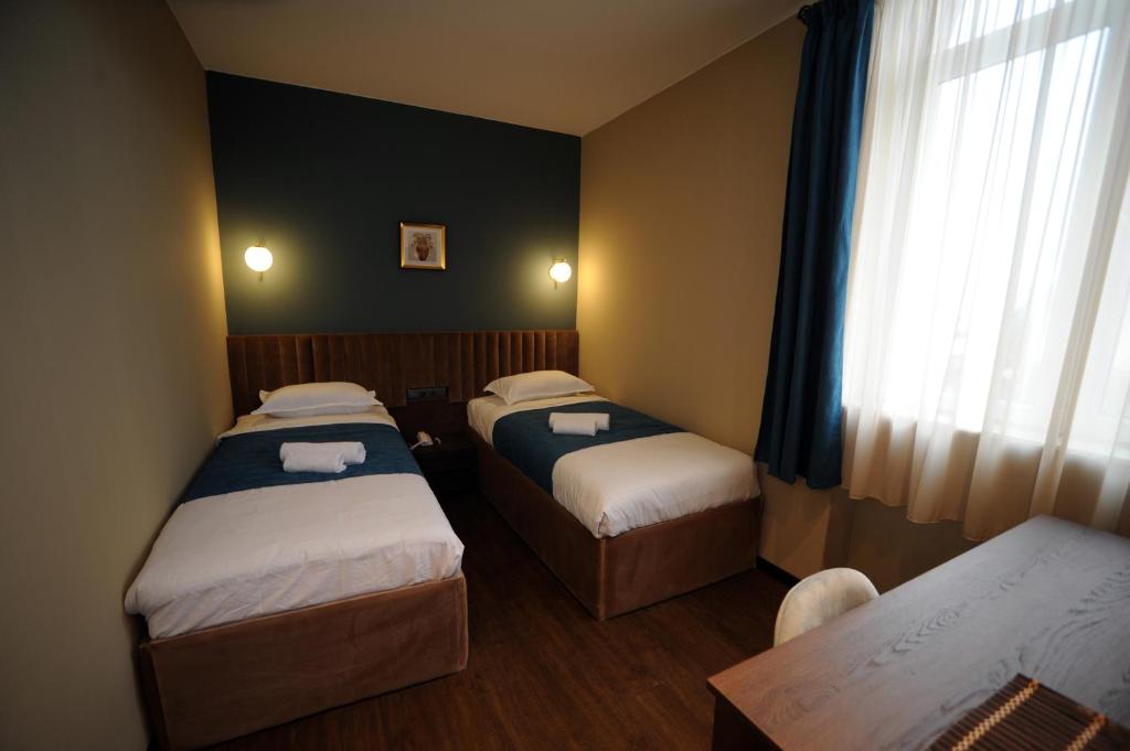 Postel nebo postele na pokoji v ubytování Hotel Verisima