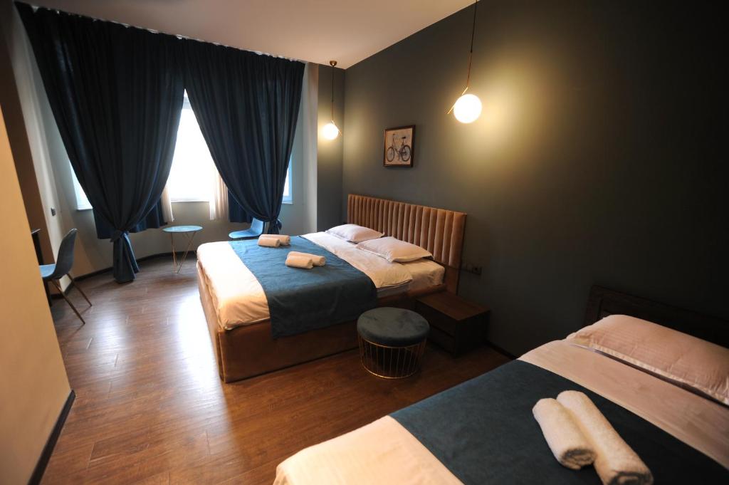 Postel nebo postele na pokoji v ubytování Hotel Verisima