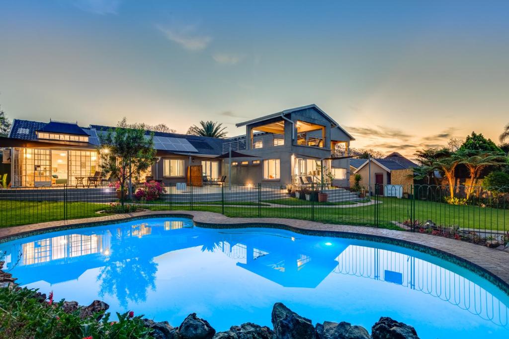 a house with a swimming pool in front of it at 49-on-Cherry in Johannesburg