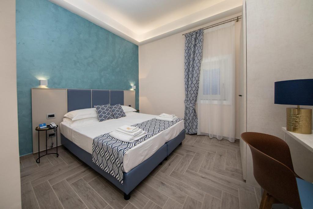 Postel nebo postele na pokoji v ubytování Hotel L'Ariana ISOLE EOLIE - UNA Esperienze