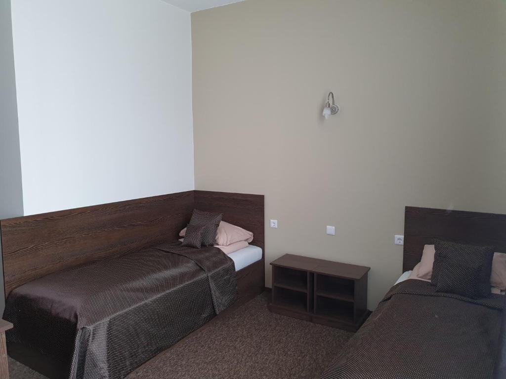 Postel nebo postele na pokoji v ubytování Svetainė
