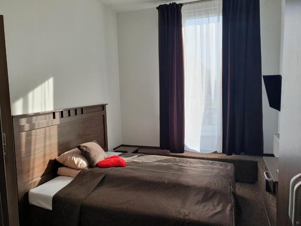 Postel nebo postele na pokoji v ubytování Svetainė
