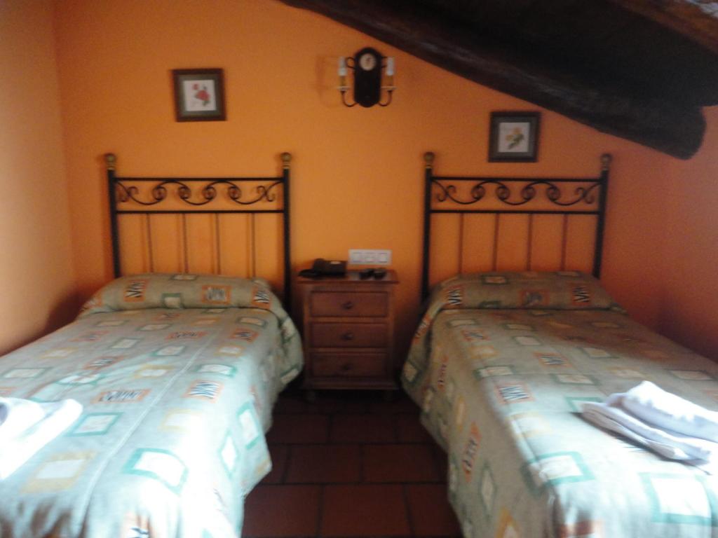 A bed or beds in a room at Hostal Venta Liara