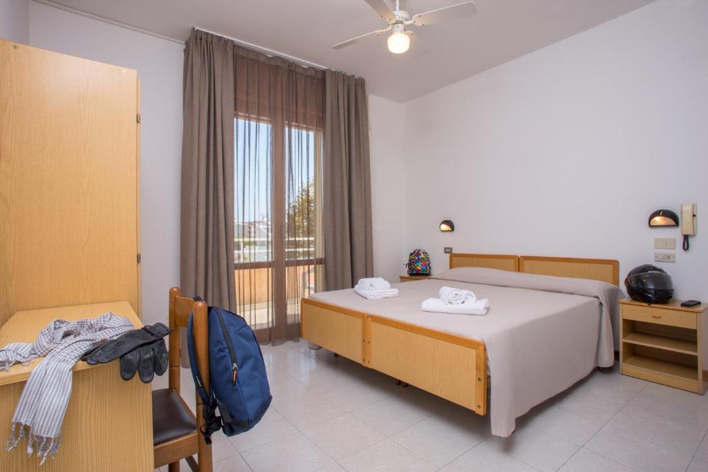 Postel nebo postele na pokoji v ubytování Hotel Maioli - Colazione XXL fino alle 12