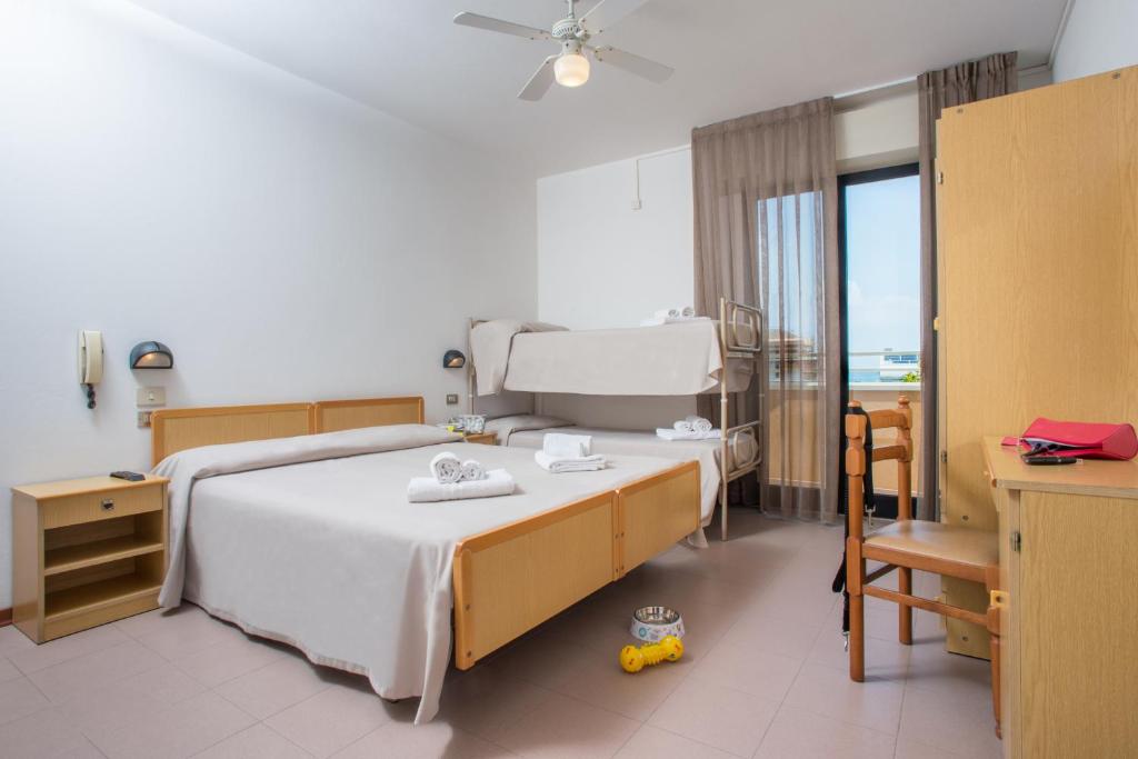 Postel nebo postele na pokoji v ubytování Hotel Maioli - Colazione XXL fino alle 12