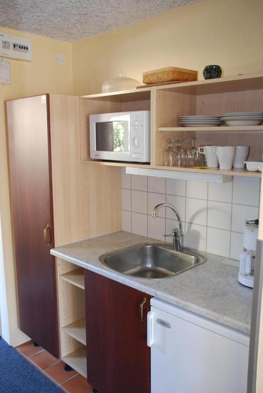 Kuchyň nebo kuchyňský kout v ubytování Munkamöllan Logi Skåne Tranås