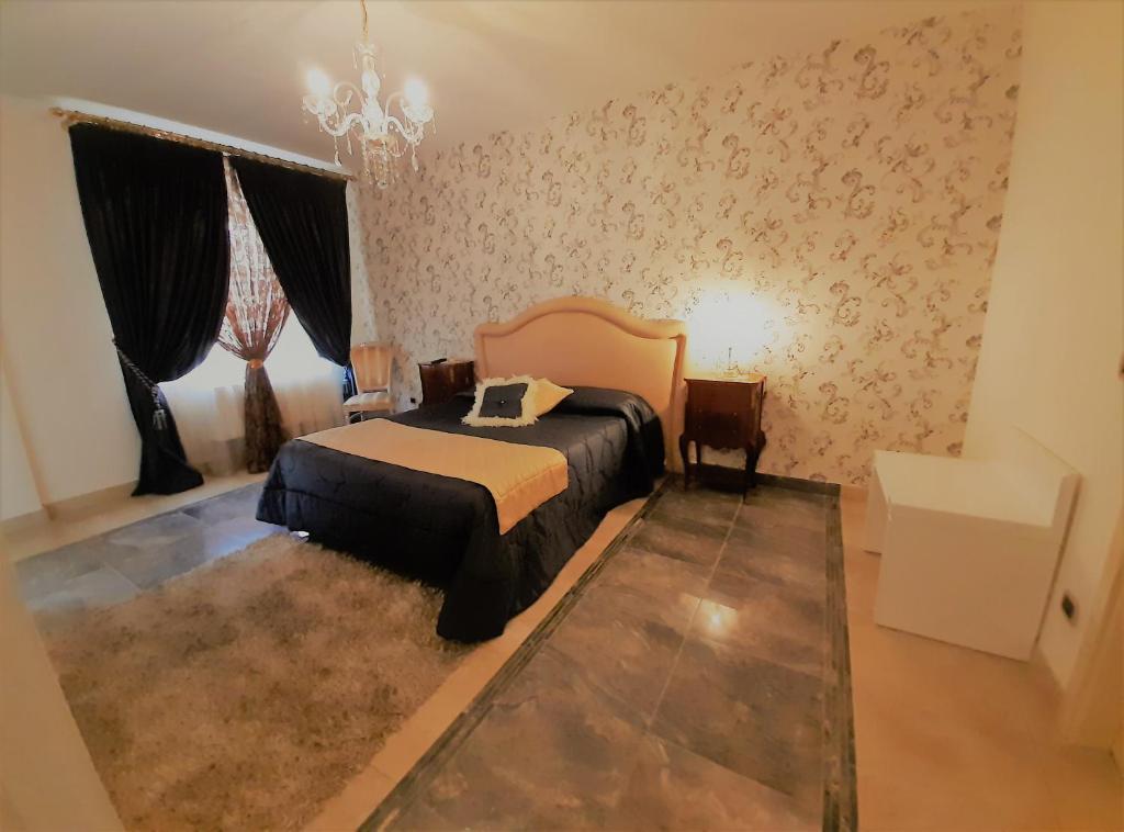 Postel nebo postele na pokoji v ubytování Regina di Saba - Hotel Villa per ricevimenti