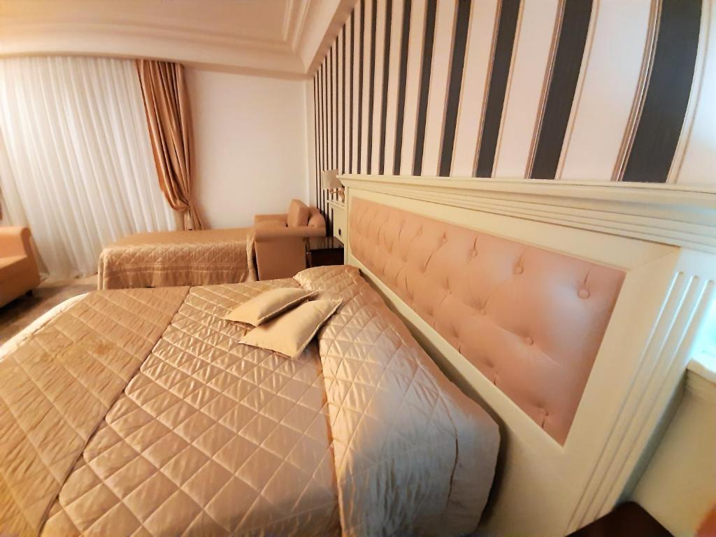 Postel nebo postele na pokoji v ubytování Regina di Saba - Hotel Villa per ricevimenti