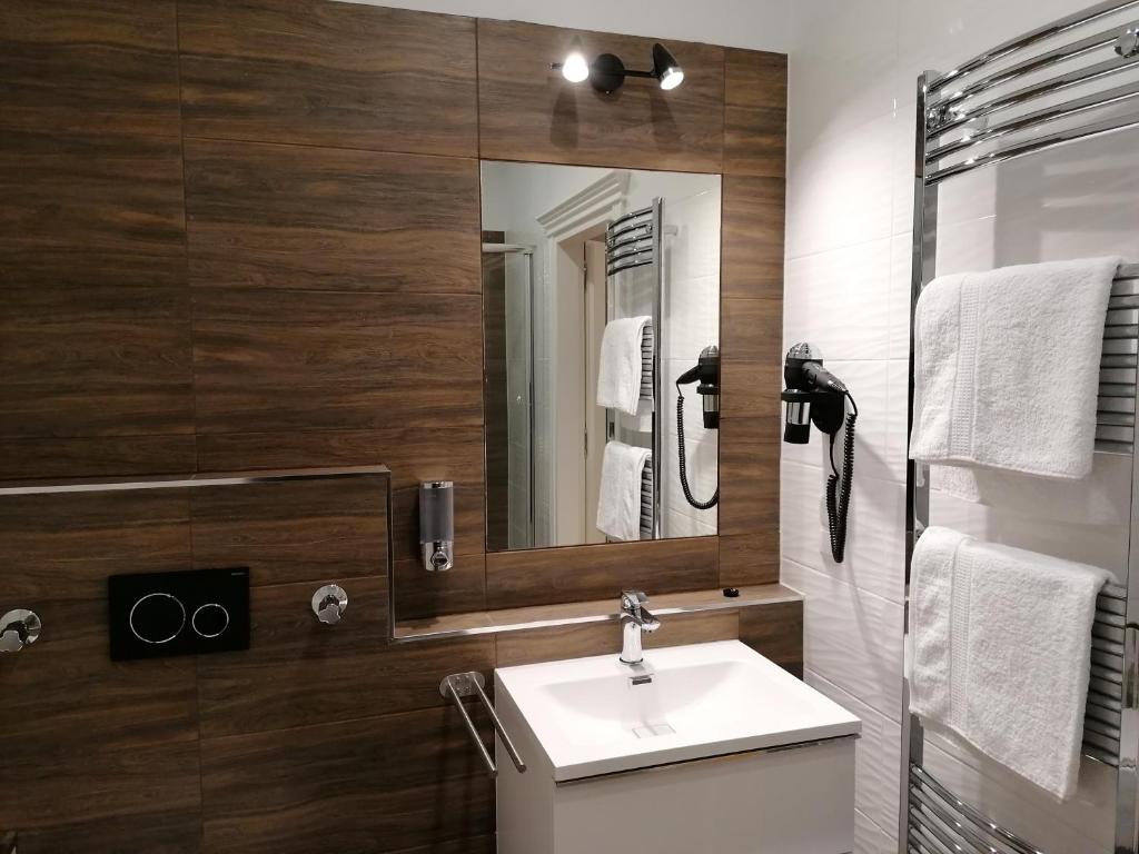 Koupelna v ubytování GOLDEN STAR - Premium Apartments