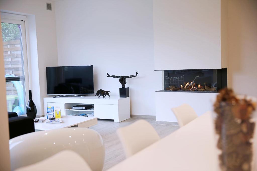 TV a/nebo společenská místnost v ubytování B&B Intermezzo
