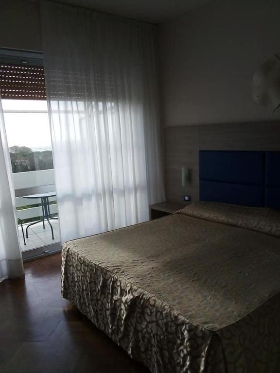 Postel nebo postele na pokoji v ubytování Grand Hotel Golf