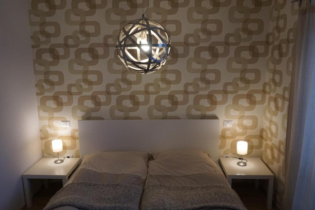 Postel nebo postele na pokoji v ubytování Apartments Supermjau