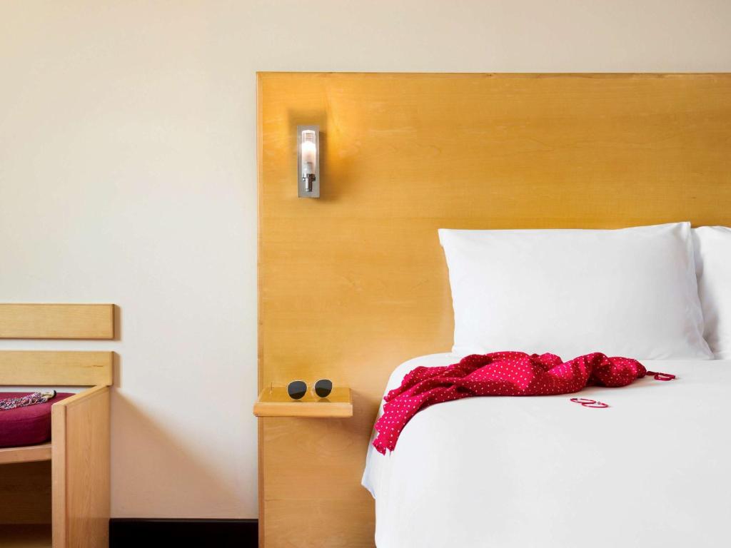 Postel nebo postele na pokoji v ubytování ibis Muscat