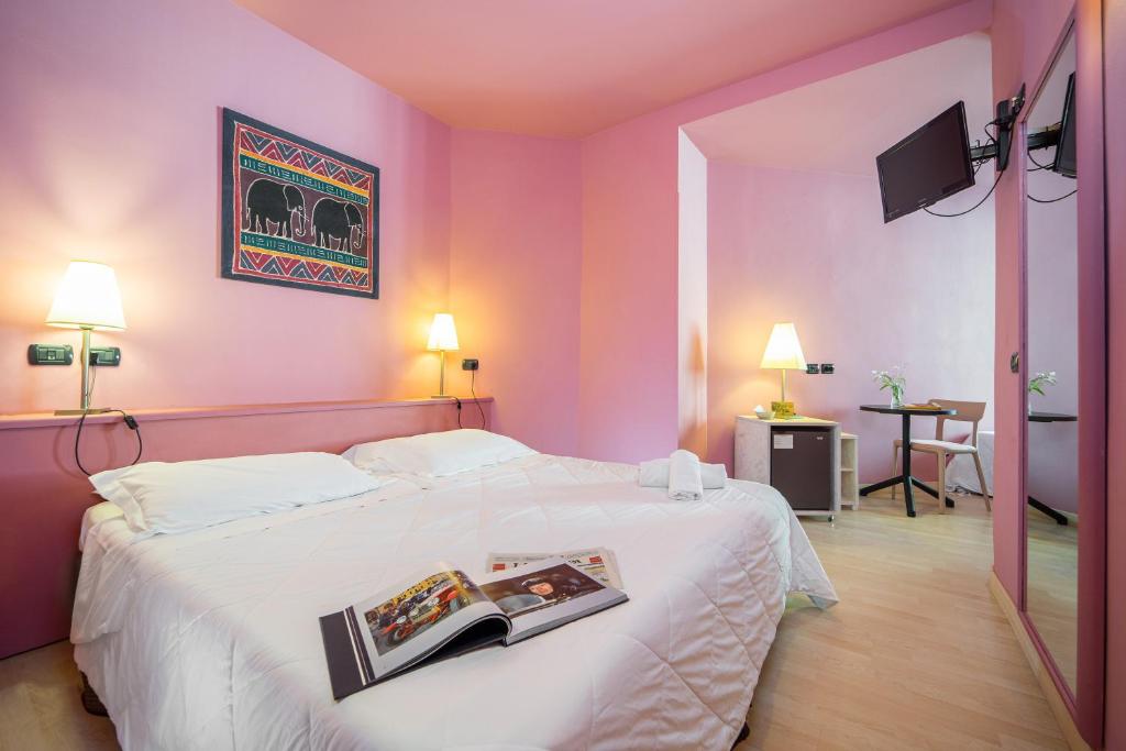 Postel nebo postele na pokoji v ubytování Hotel Corallo Rimini