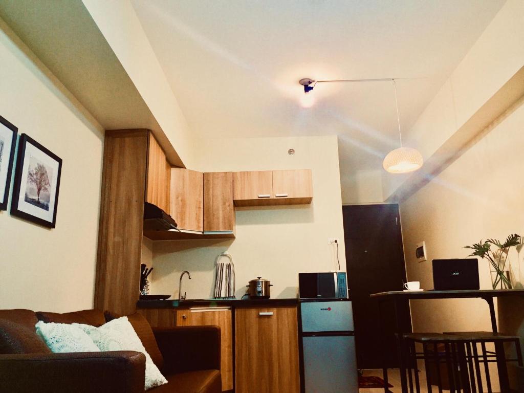 Kuchyň nebo kuchyňský kout v ubytování Cozy studio in Cebu IT Park