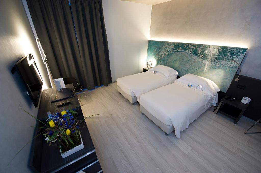 Postel nebo postele na pokoji v ubytování Arli Hotel Business and Wellness