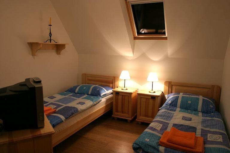 Postel nebo postele na pokoji v ubytování Chalupa Bella