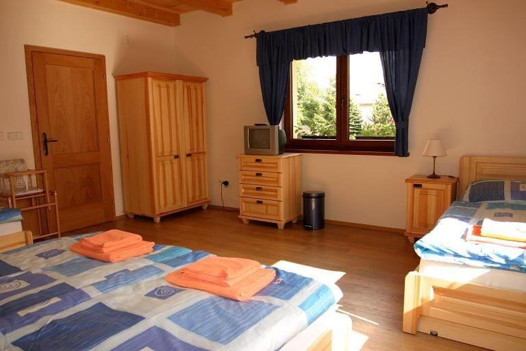 Postel nebo postele na pokoji v ubytování Chalupa Bella