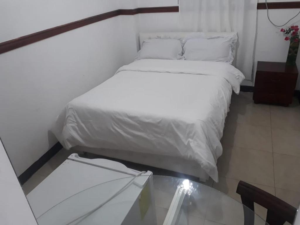 Postel nebo postele na pokoji v ubytování Hotel Rumbo al Sol