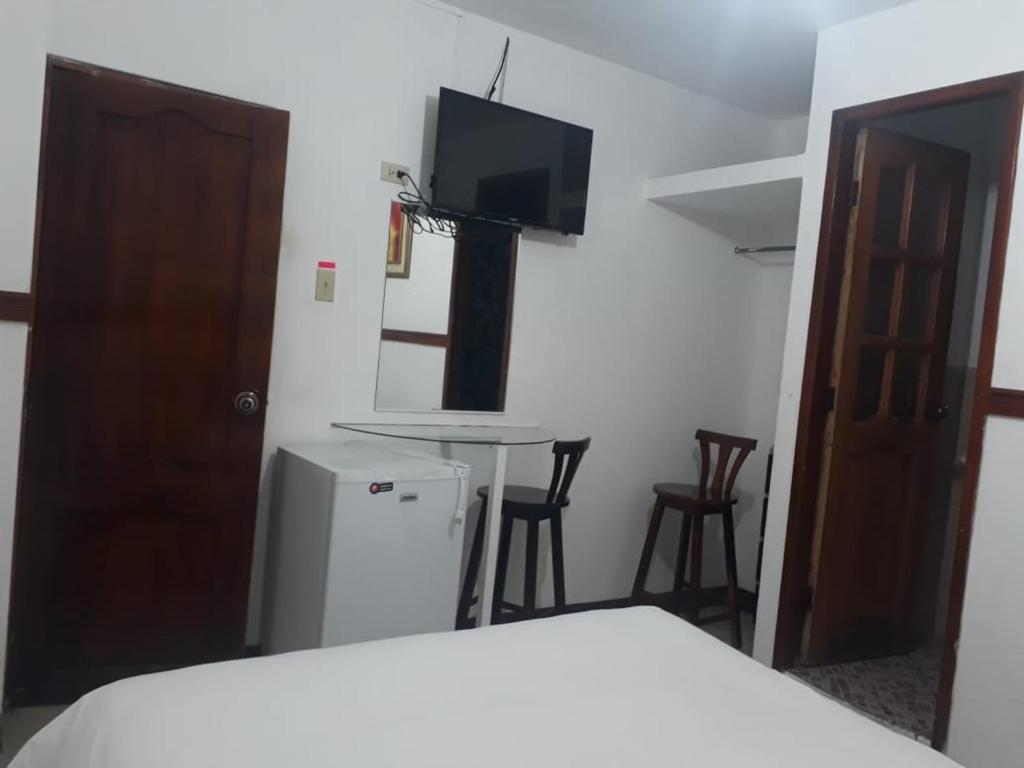 Postel nebo postele na pokoji v ubytování Hotel Rumbo al Sol