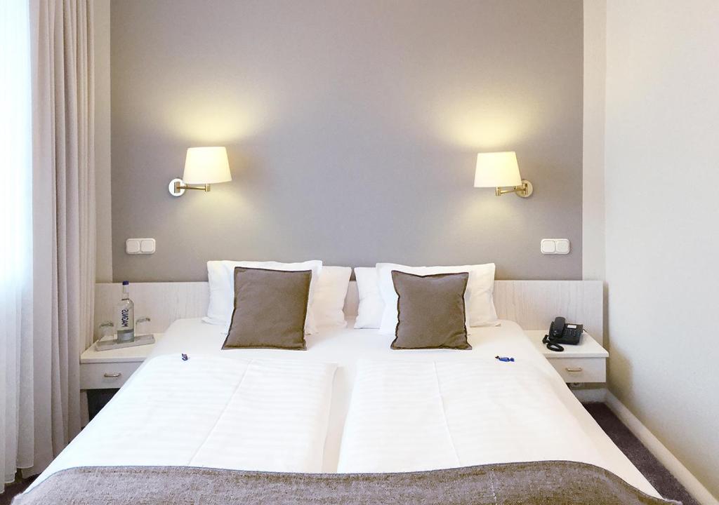 Postel nebo postele na pokoji v ubytování Hotel Ancora