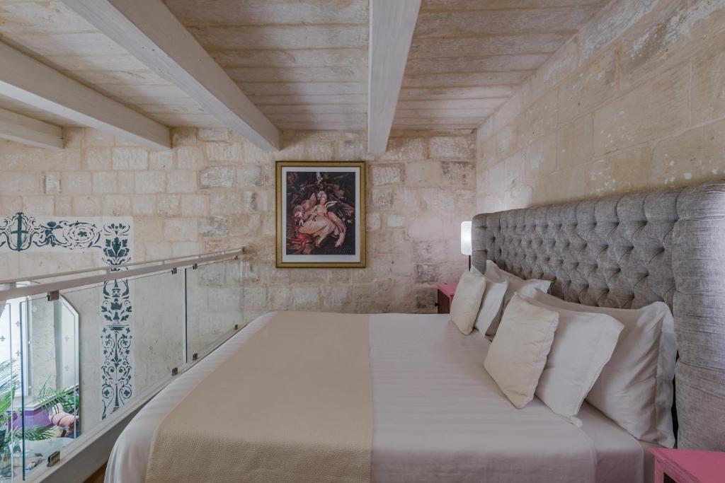 Postel nebo postele na pokoji v ubytování Valletta Lucente Guest House