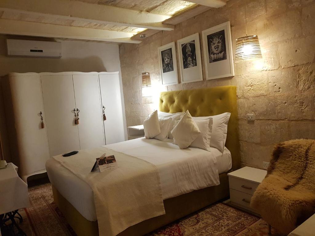 Postel nebo postele na pokoji v ubytování Valletta Lucente Guest House