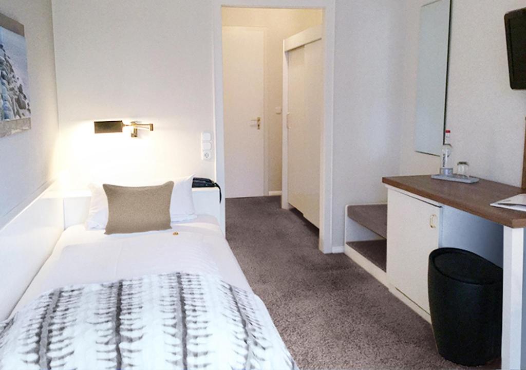 Postel nebo postele na pokoji v ubytování Hotel Ancora