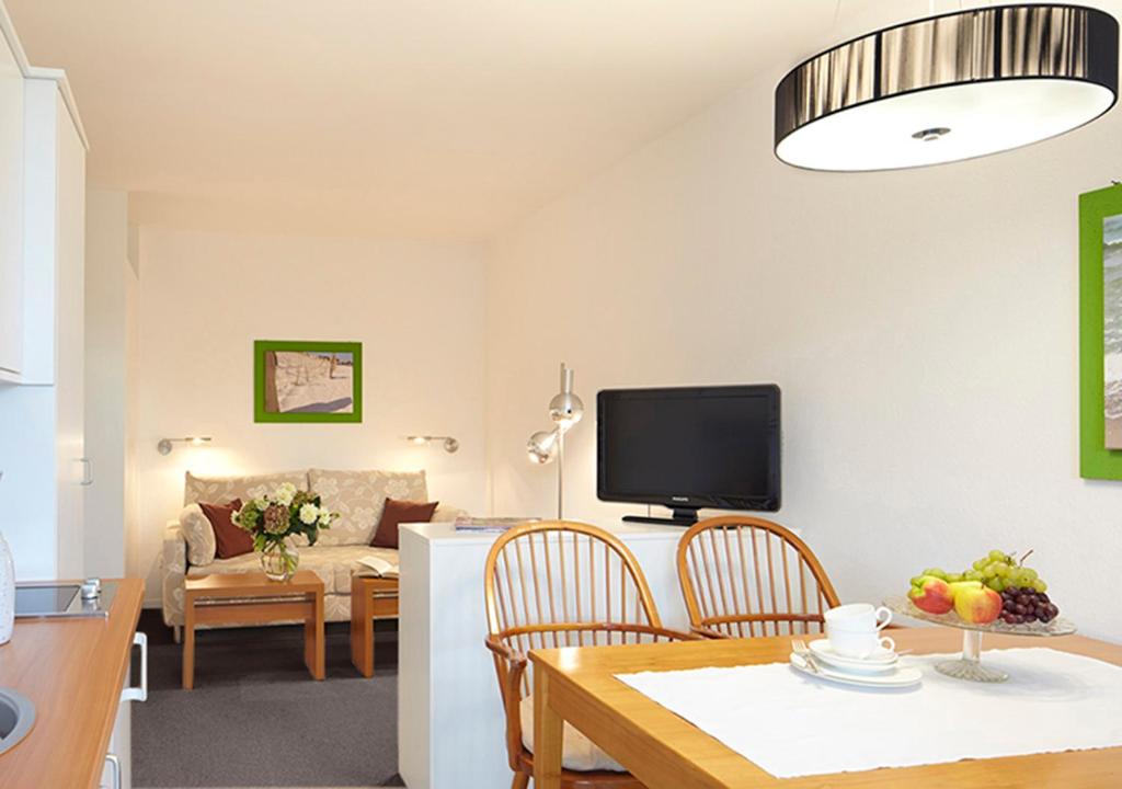 TV a/nebo společenská místnost v ubytování Hotel Ancora