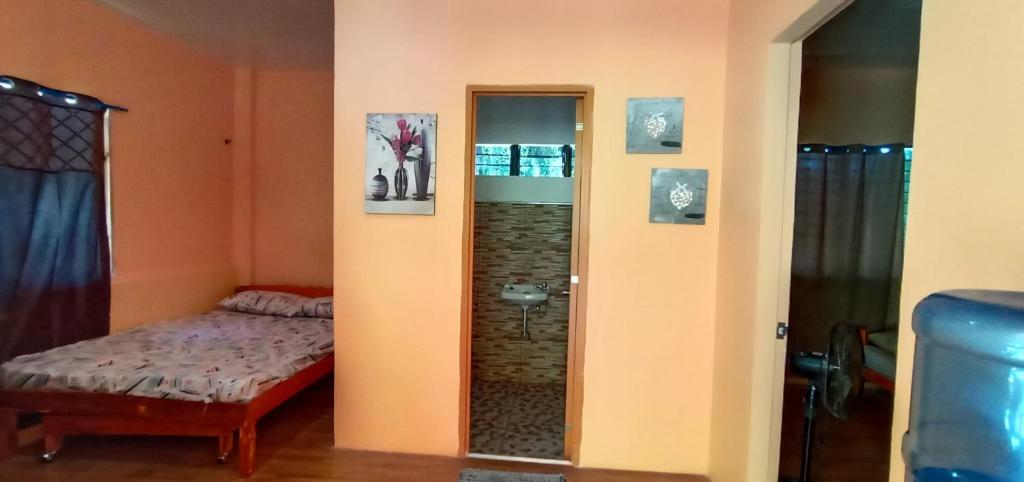 Postel nebo postele na pokoji v ubytování House Rental Banaba Tree