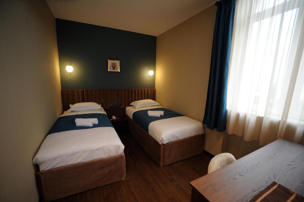 Postel nebo postele na pokoji v ubytování Hotel Verisima