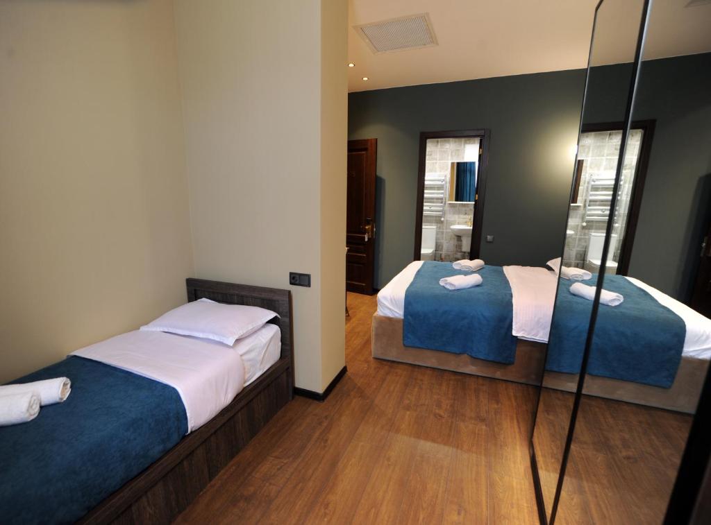 Postel nebo postele na pokoji v ubytování Hotel Verisima