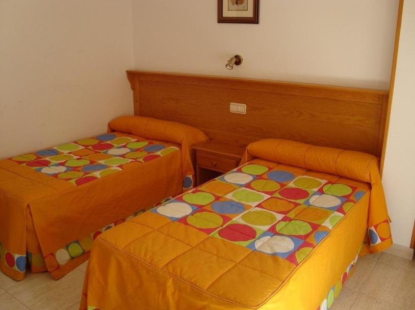 Posteľ alebo postele v izbe v ubytovaní Hostal Vinuesa
