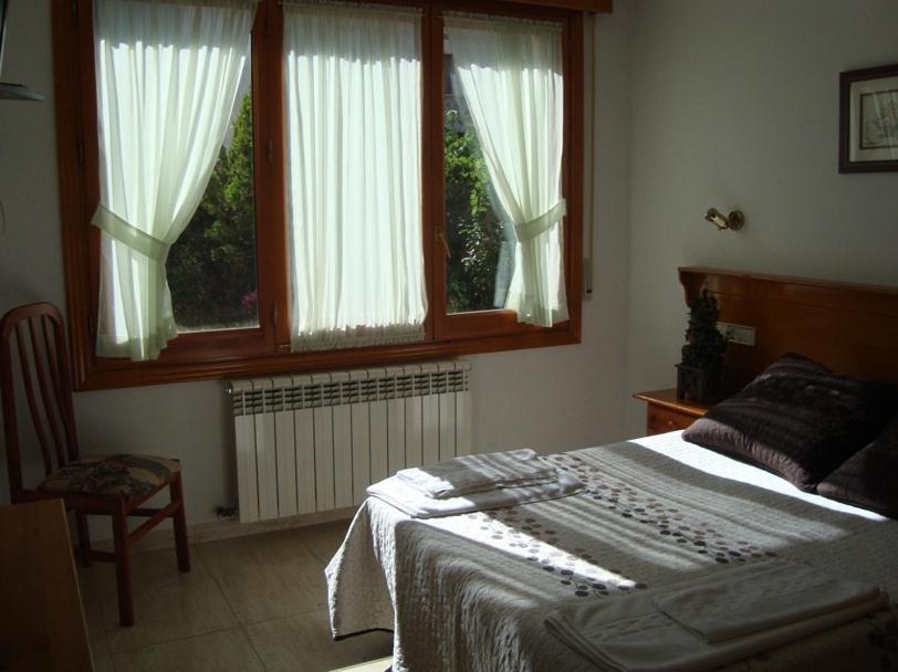 Posteľ alebo postele v izbe v ubytovaní Hostal Vinuesa