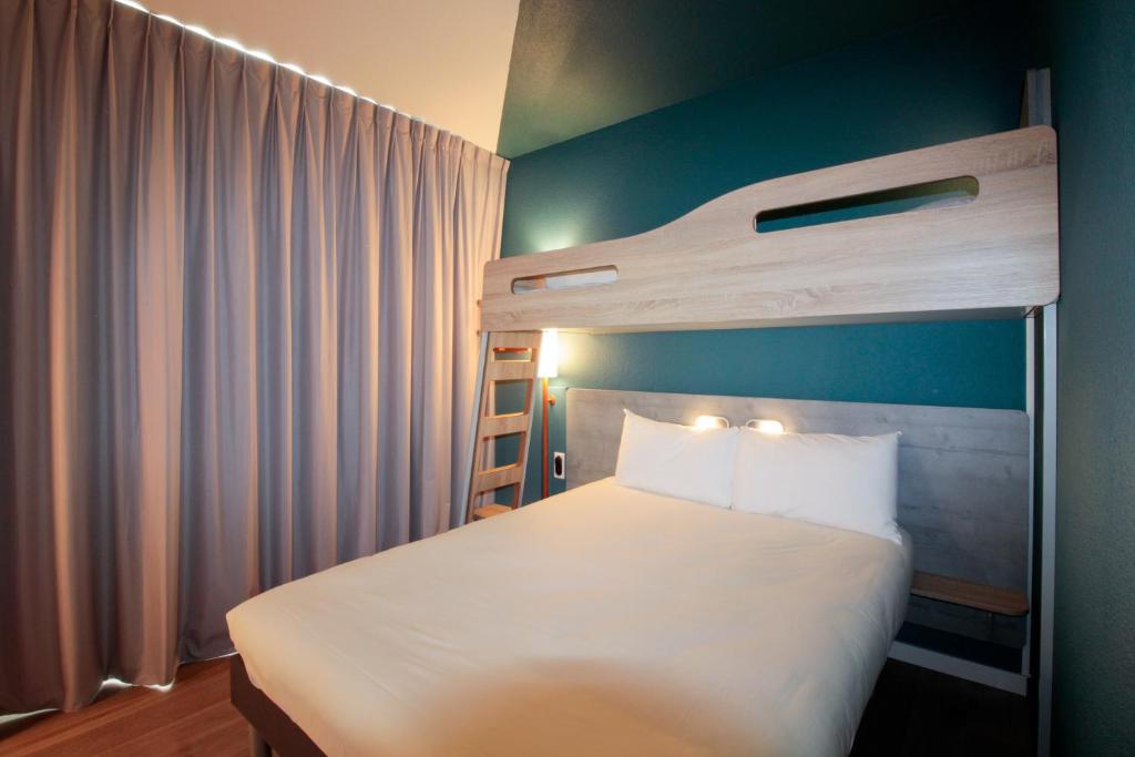 Postel nebo postele na pokoji v ubytování ibis budget Cahors