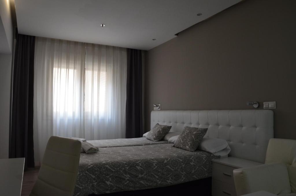 Postel nebo postele na pokoji v ubytování Boutique Urban Madrid Serrano