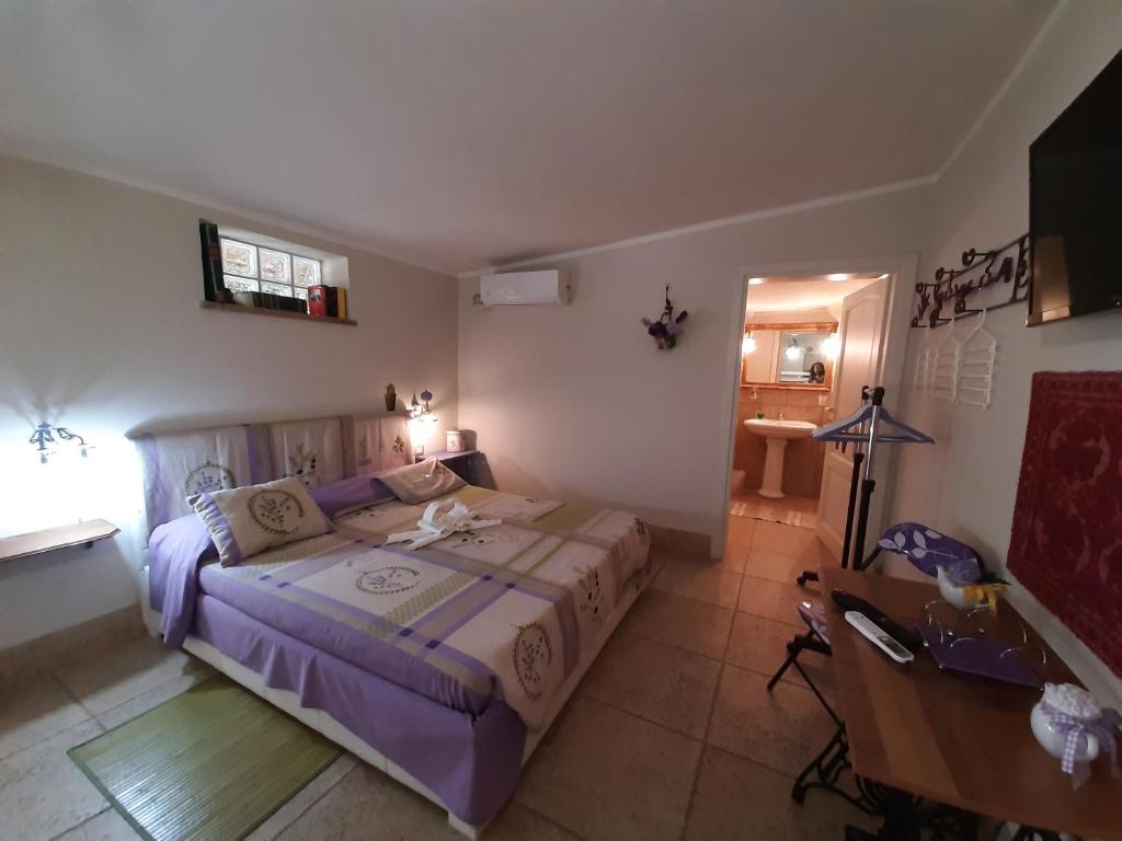Postel nebo postele na pokoji v ubytování casa di campagna dal pozzo