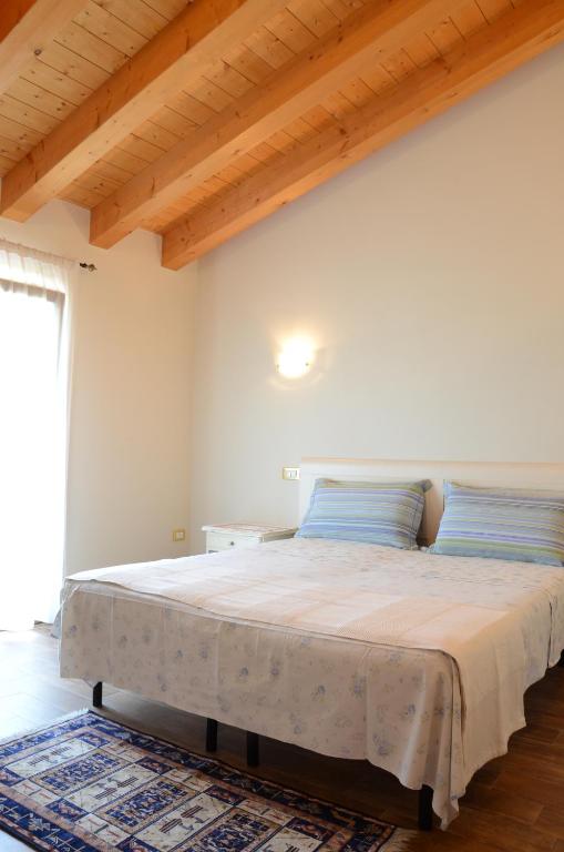 Postel nebo postele na pokoji v ubytování B&B Al Lauro