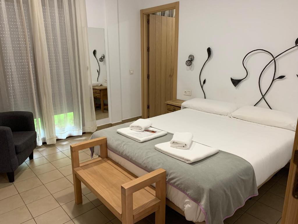 Postel nebo postele na pokoji v ubytování Hostal Aquaforum