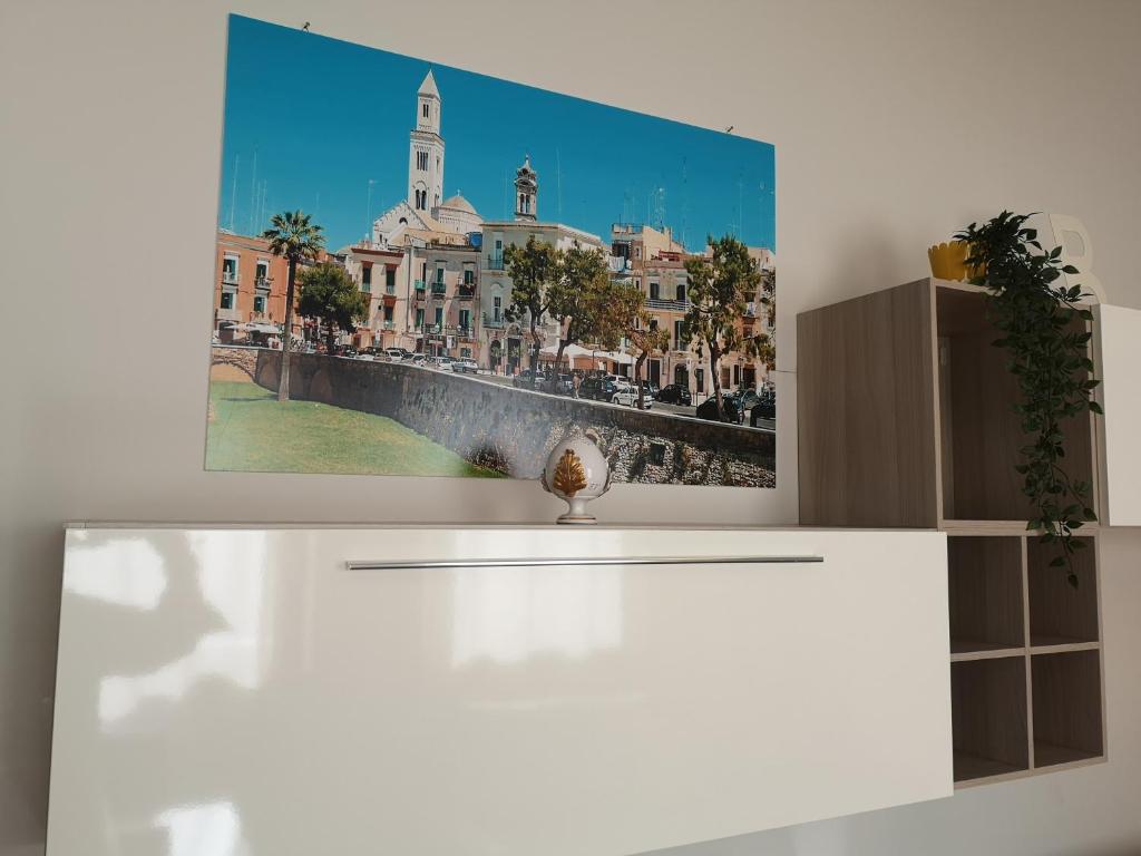 a wall with a picture of a city at Berga Exclusive Suite 3 in Bari