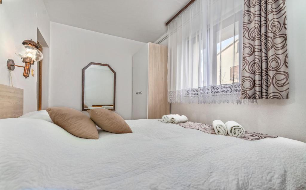 Postel nebo postele na pokoji v ubytování Apartments Vera Savic