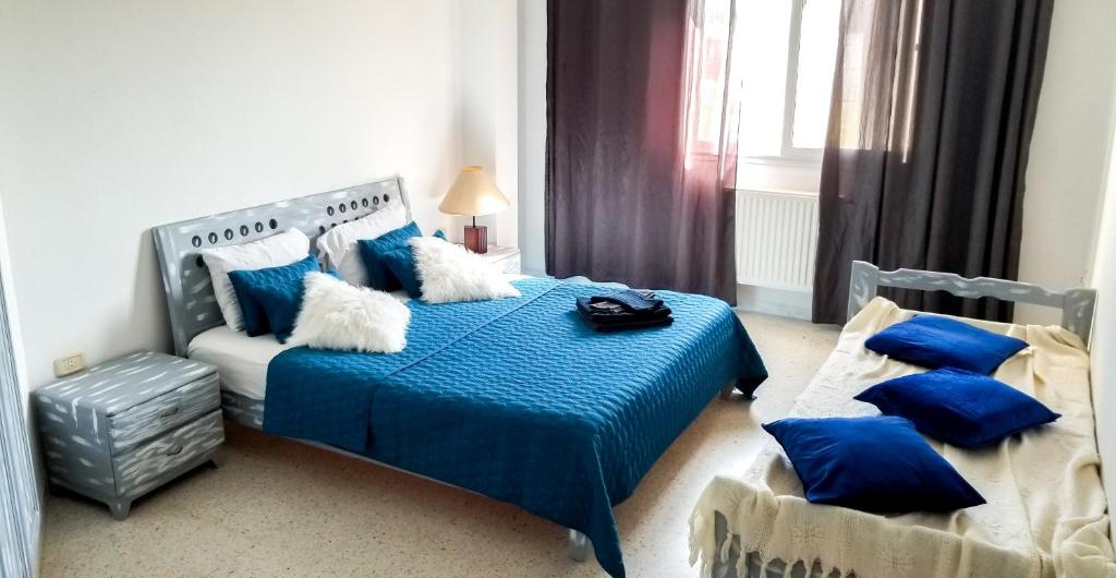 Postel nebo postele na pokoji v ubytování Mahdia Place Apartments